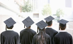 Rear view of graduates in caps and gowns