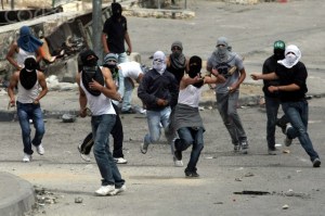 Palestinians throw rocks atIsraeli police in Silwan area of East Jerusalem ahead of Nakba Day